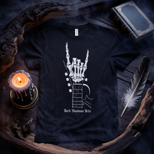 Dark Shadows Arts Premium Gothic Rock T-Shirt „Bones of Rock“ mit Skelett-Hand im Metal-Horns-Gesture auf Gitarrenhals, minimalistisches Schwarz-Weiß-Design als atmosphärisches Classix Flatlay-Mockup