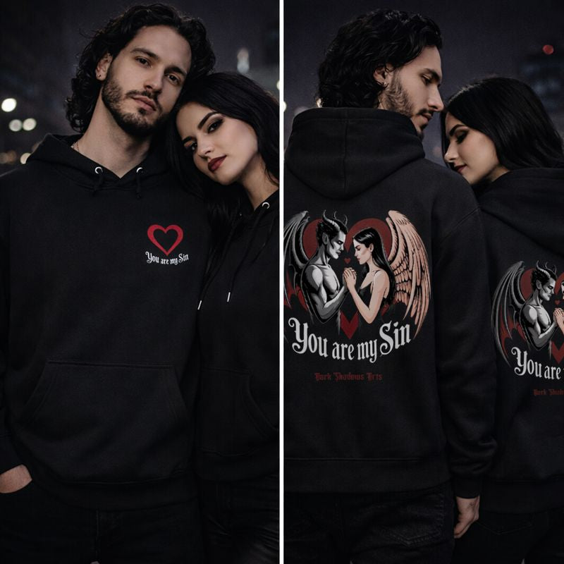 Dark Shadows Arts Premium Hoodie in Schwarz mit Brustprint „You Are My Sin“ – Gothic Paar mit Model, Dark Romantic Design mit rotem Herz, Frontansicht im urbanen Nacht-Setting