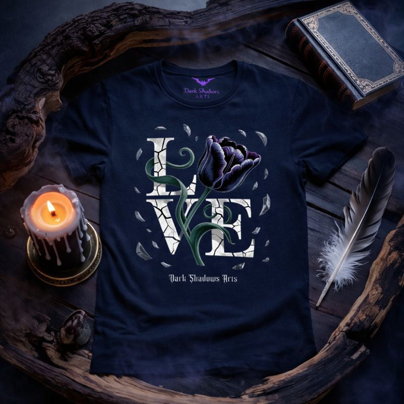 Premium Gothic T-Shirt „Shattered Bloom“ von Dark Shadows Arts mit gebrochener LOVE-Typografie und dunkler Rose auf schwarzem Shirt, inszeniert in stimmungsvoller Dark-Romance-Mockup-Szene.